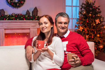 couple with cups of hot drinks