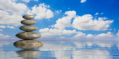 Obraz na płótnie Canvas Zen stones stack on blue background. 3d illustration