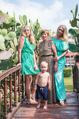 Naklejka premium Family includes grandmother, mother, girl and boy in the Park
