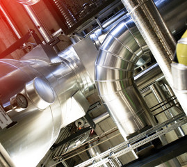 Equipment, cables and piping as found inside of a modern industrial power plant