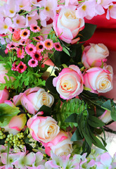 Colorful artificial roses flowers.