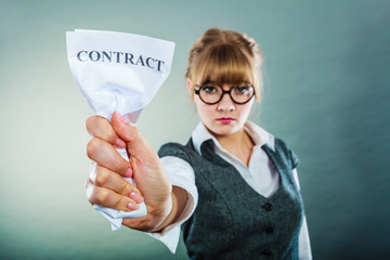 unhappy business woman showing crumpled contract