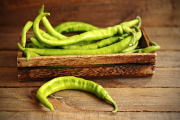 green peppers on wood