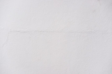 White paint on crack concrete wall texture background