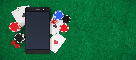 Composite image of mobile phone with playing cards and stack of