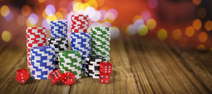 Composite image of stack of colorful casino tokens with dice