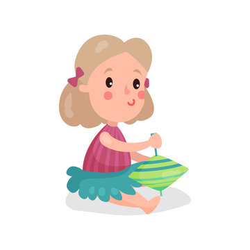 Sweet blonde little girl sitting on the floor playing with humming top cartoon vector Illustration
