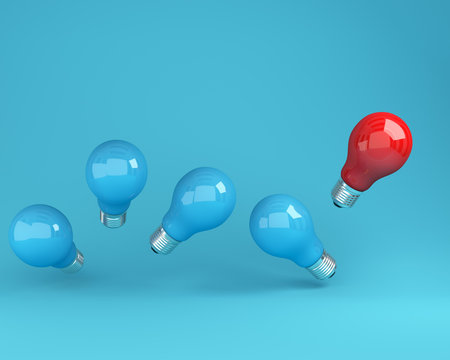 Outstanding light bulbs red in air one different idea from the others on  blue background, Minimal concept idea.