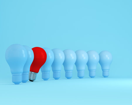 Row of light bulbs red one different idea from the others on light blue background, Minimal concept idea.