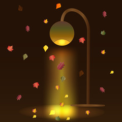 autumn leaves under a street lamp