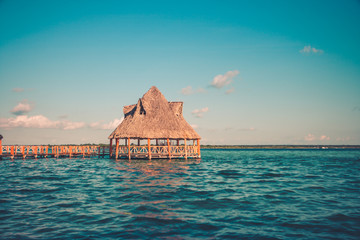 Pier with clouds and blue water at the Laguna Bacalar, Chetumal, Quintana Roo, Mexico.