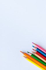 Group of colorful pencils on a white background. Close up and copy space.