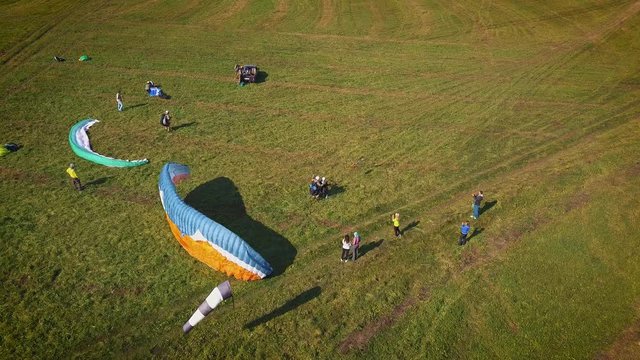 Paraplane, paraglider in the air aerial shot. Extreme life. A man is flying on a paraglider