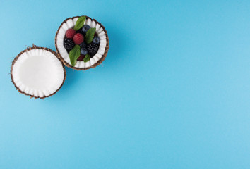 Fruits of coconuts with mix of berries.