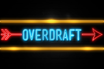 Overdraft  - fluorescent Neon Sign on brickwall Front view