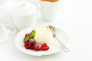 Delicious home-made dessert Panna cotta. Cream-caramel, caramel custard, with raspberries.