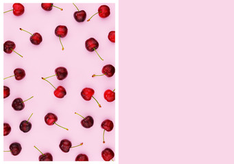 Ripe sweet cherries on pink background.