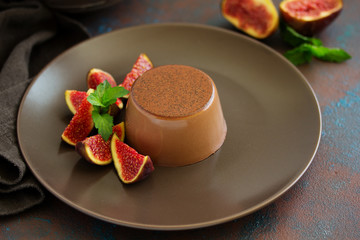 Delicious home-made chocolate dessert Panna cotta. Cream-caramel, caramel custard, with figs.