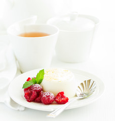 Delicious home-made dessert Panna cotta. Cream-caramel, caramel custard, with raspberries.