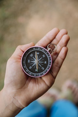 Asian boy holding compass