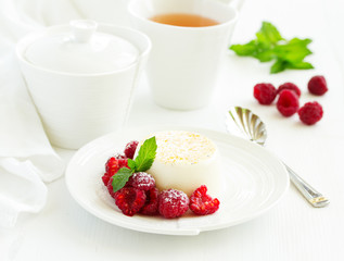 Delicious home-made dessert Panna cotta. Cream-caramel, caramel custard, with raspberries.