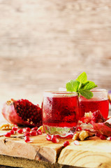 Fresh pomegranates and juice, selective focus