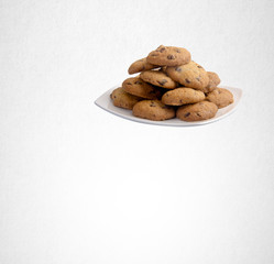 Cookies or Chocolate chips cookies on background.