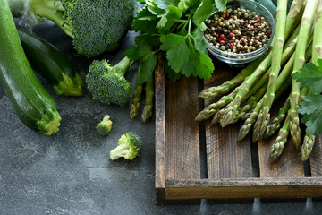 Green vegetables for healthy cooking, harvest or diet concept, asparagus, zucchini, broccoli, vegan eating