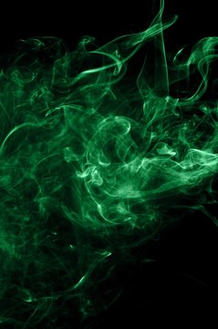 Abstract green smoke on black background, smoke background,green ink background,green, beautiful color smoke