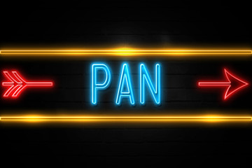 Pan  - fluorescent Neon Sign on brickwall Front view