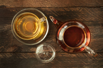 Vibrant teapot with cup of tea and copy space