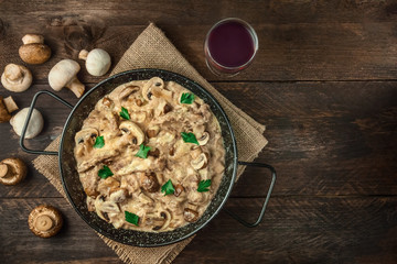 Mushroom beef stroganoff in pan with copy space