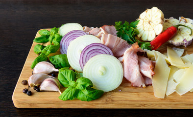 Sliced smoked bacon with onion, garlic, cheese, basil