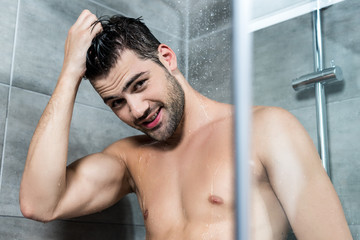 young man taking shower