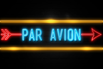 Par Avion  - fluorescent Neon Sign on brickwall Front view