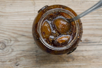 Top view of a pot with fresh figs cut in pieces prepared for figs  jam cooking.