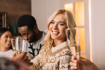smiling woman with glass of champagne