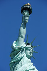 Fototapeta na wymiar Statue of Liberty lateral view detail in a sunny day, blue sky in New York