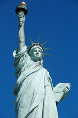 Fototapeta na wymiar Statue of Liberty in New York, clear blue sky