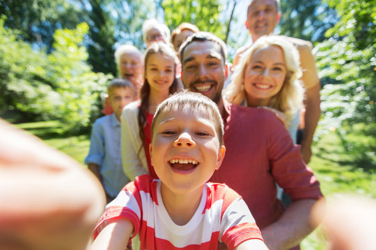 happy family taking selfie in summer garden
