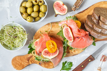 sandwich with fish, rye bread and figs