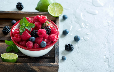 Fresh summer berries, raspberry, blueberry, blackberry in a bowl, raw vegan eating