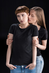 Young woman embracing girlfriend