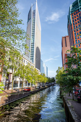 View on the water channel and beautiful skyscrapers in Haag city, Netherlands - obrazy, fototapety, plakaty