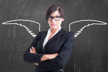 Female teacher angel with chalk wings on blackboard