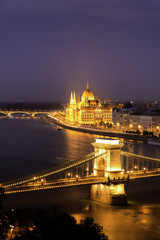 Fototapeta na wymiar Budapest, Hungary, Chain Bridge over Danube River and Hungarian Parliament Building at Dusk