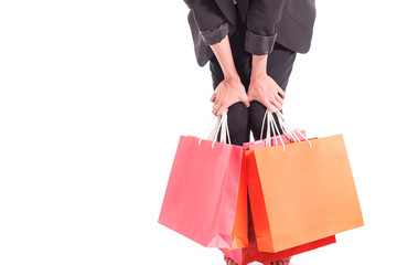 Closed up of Cheerful shopping woman of Asian holding bags. Shopping smart business woman unhappy Bored and tired holding colorful shopping bags isolated on white . Fresh young Asian female model