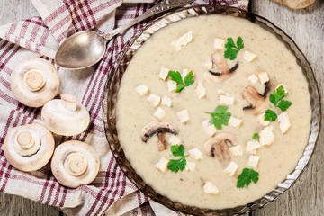 Mushroom cream soup with croutons and spices