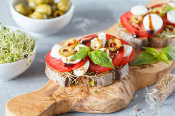 sandwiches with mozzarella, tomatoes and olives