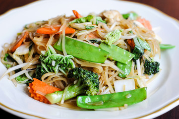 Veggie Noodle, Stir-fried thin rice noodles, bean sprouts, broccoli, carrots, baby corn, peapods, napa and sweet basil leaves.